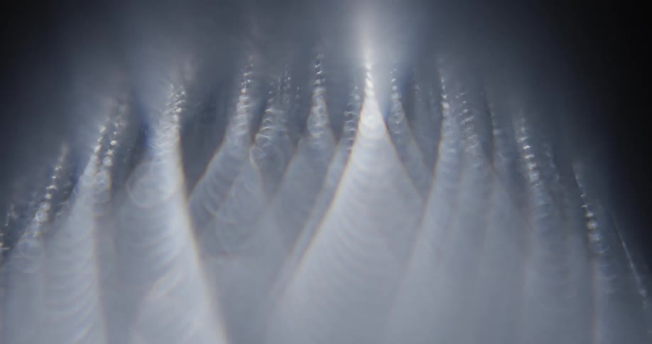 Smoke and light move through peaks