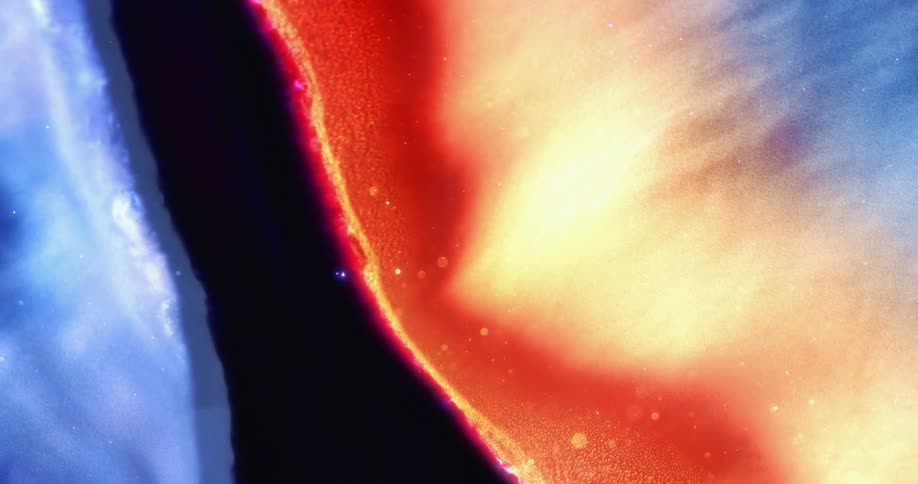 The edge of a blue pattern turns red as it spreads further