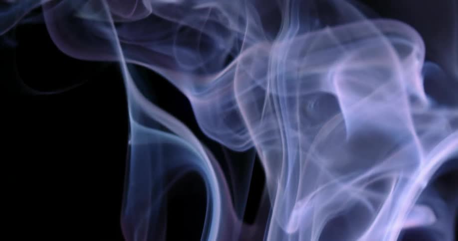Blue tinged smoke rises upward