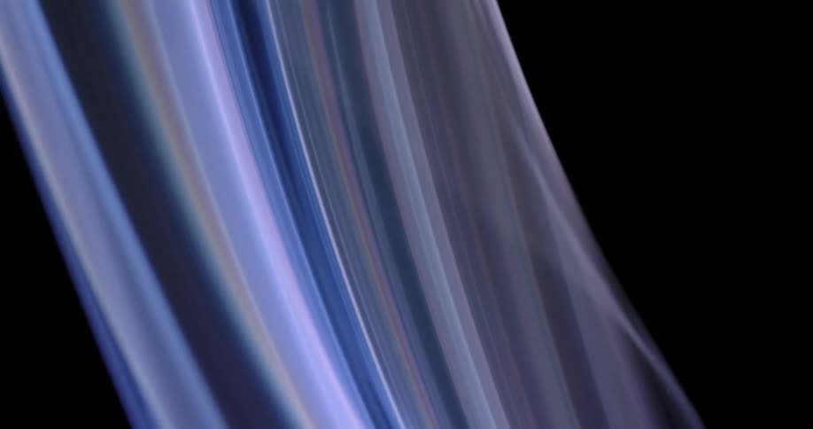 Glowing ribbons of blues and pinks swaying against black