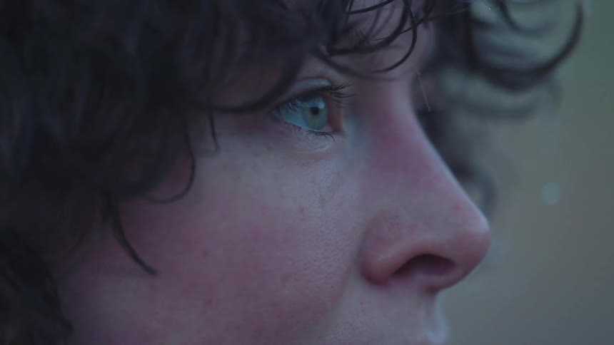 A close up of a person standing outdoors