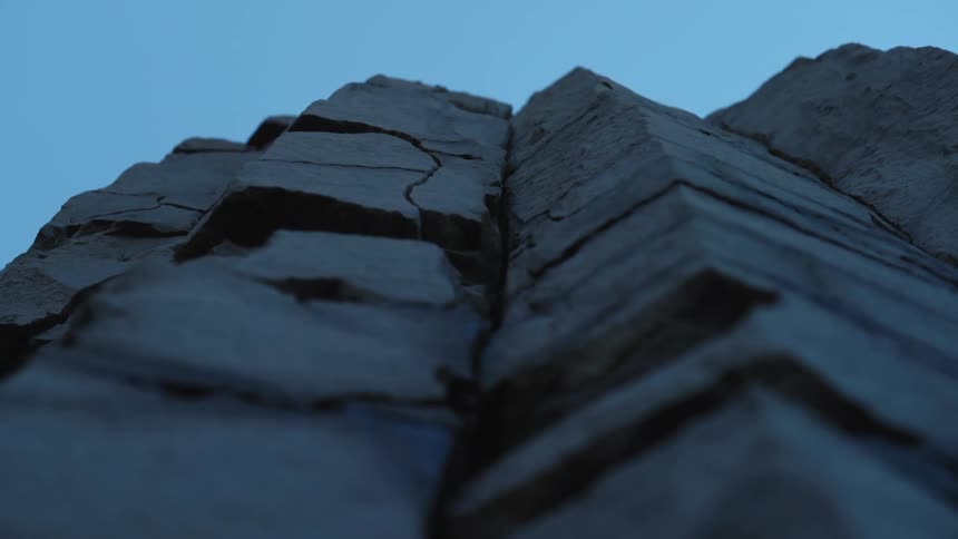 Iceland cliffs made of rock in Black Sand Beach Reynisfjara