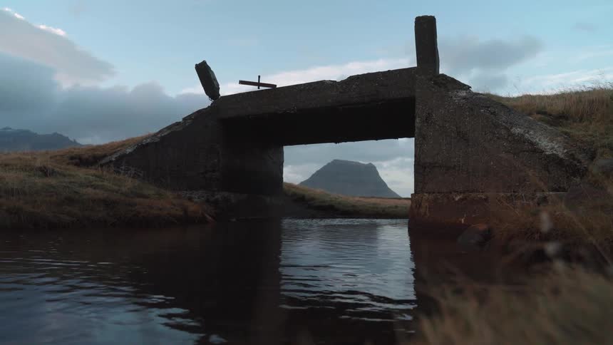 A river flows under a small bridge - Kirkjufellsfoss Iceland