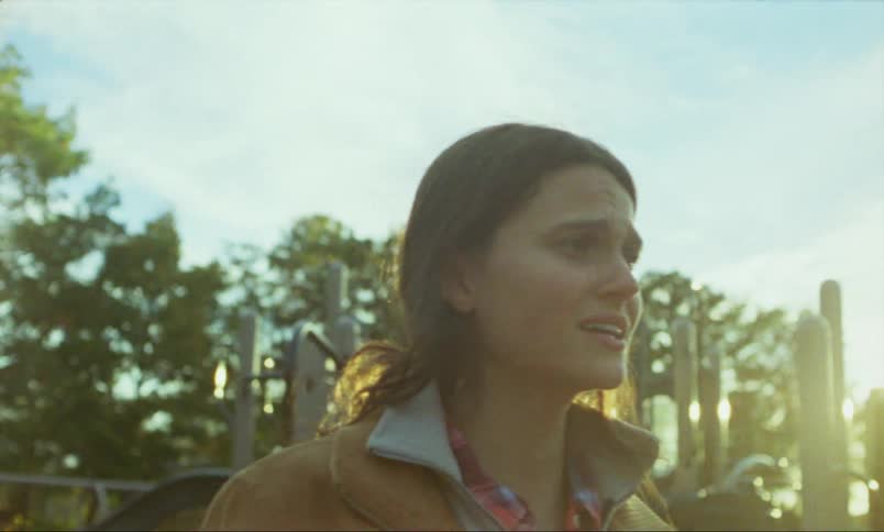Woman with brown hair and leather jacket feels agitated