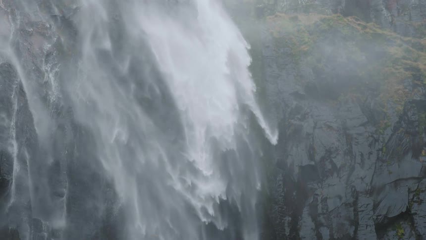 Slow motion view of a waterfall is displayed
