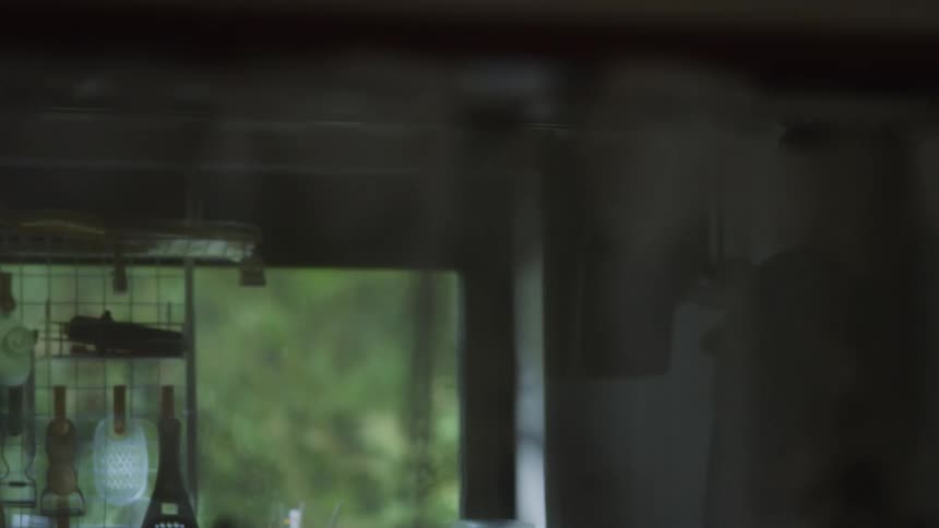 A man is walking around his house during the spring
