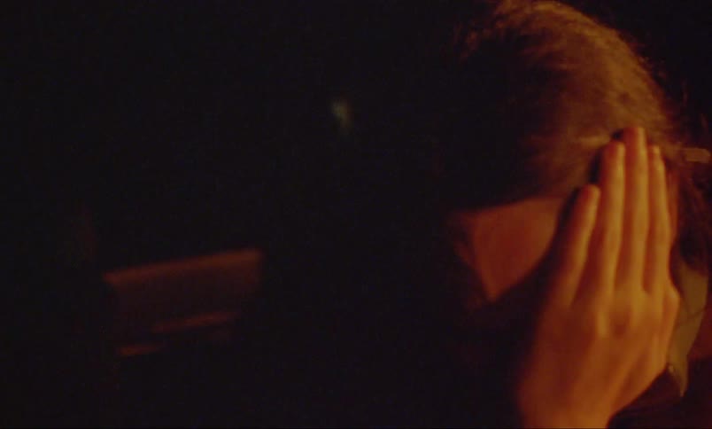 A woman crying alone in the dark