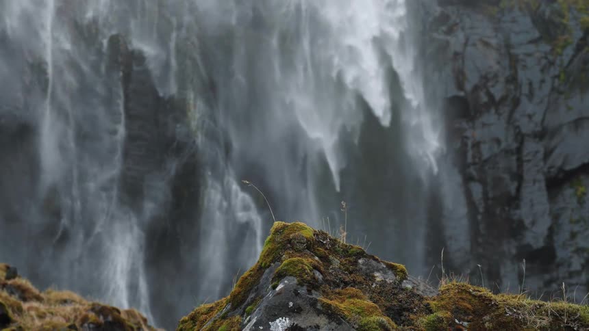 Water sprays off the mountain