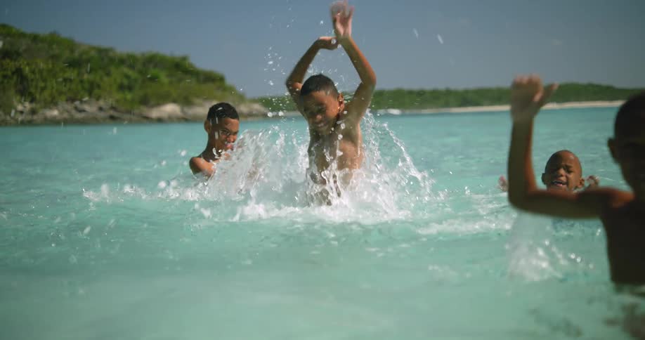Children are playing in the ocean