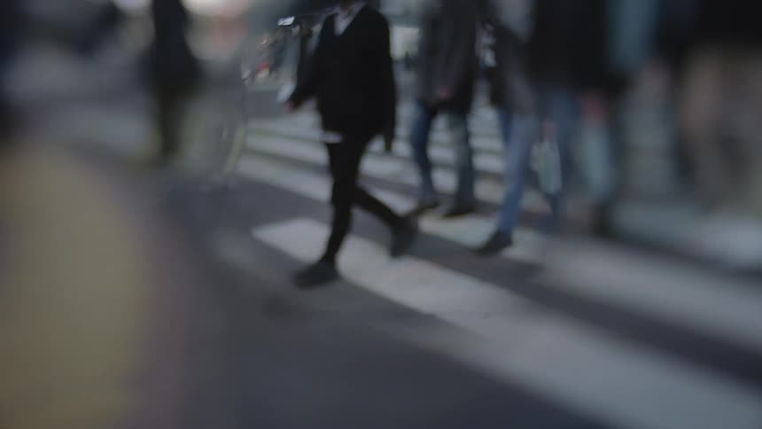 People are walking outside on the streets of the city