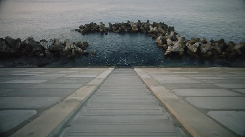 The water splashes against the stone
