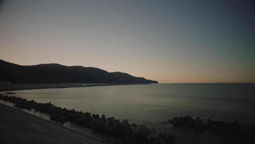 The view is of the ocean in the beginning of the morning