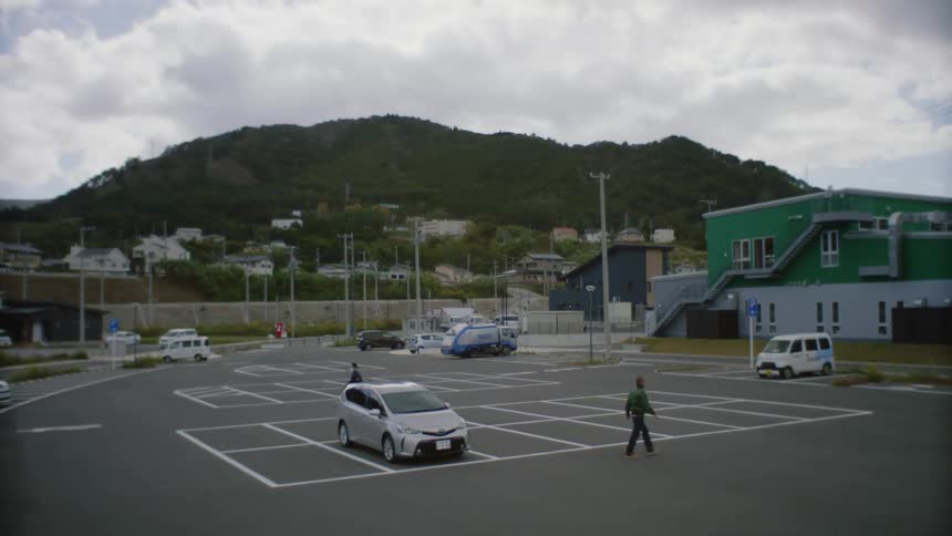 People are walking outside in the middle of the day time