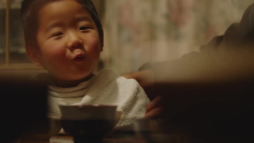 A child is eating at home