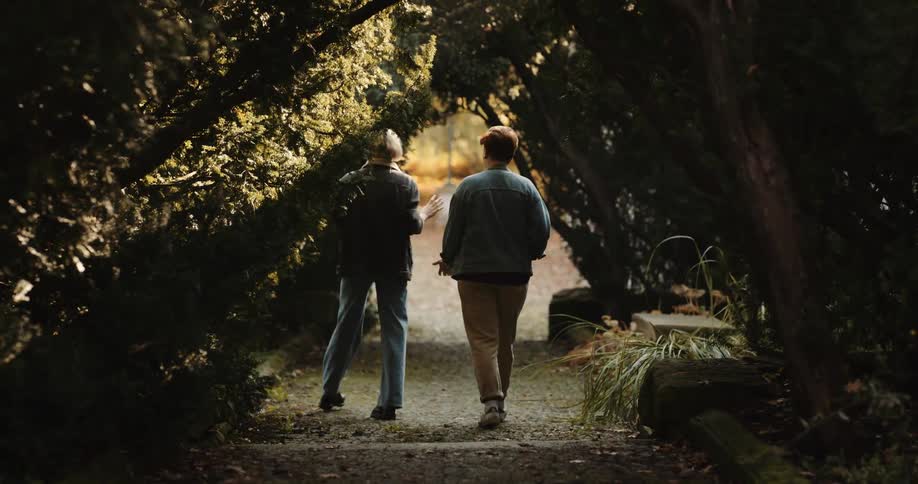 A young couple is hanging out with each other in the middle of the day