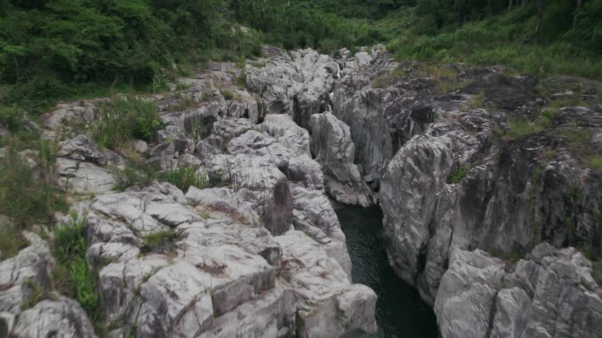 Aerial view of mountains and a river is displayed