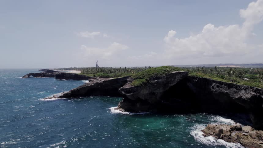 A view of an island in the ocean is displayed during spring