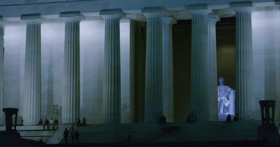 People visiting the lincoln memorial at night