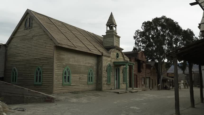 The old wooden church sits abandoned in a town empty of people