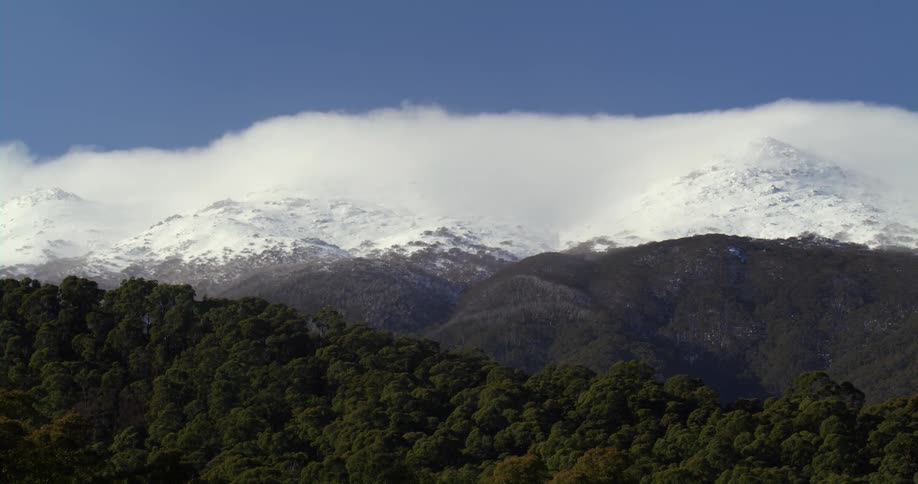 Aerial view of a mountainous landscape is displayed
