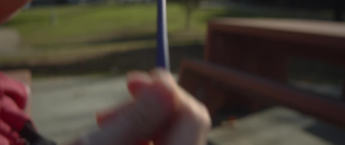 A person stretches a balloon