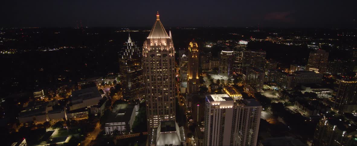 Aerial view of illuminated one atlantic center and tall buildings in the city at night