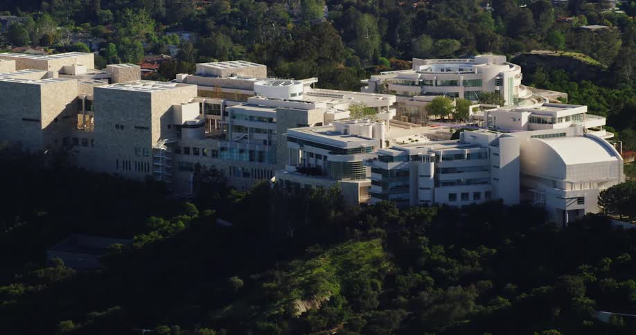 An aerial view of a large building on a hilltop