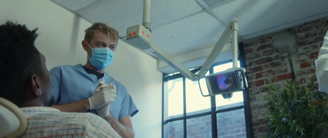 There is a patient seeing the dentist to work on his teeth