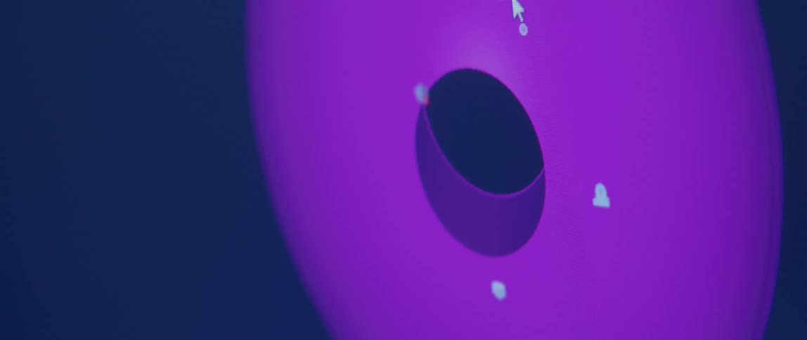 Close up of an spherical purple 3d object being rotated on a screen