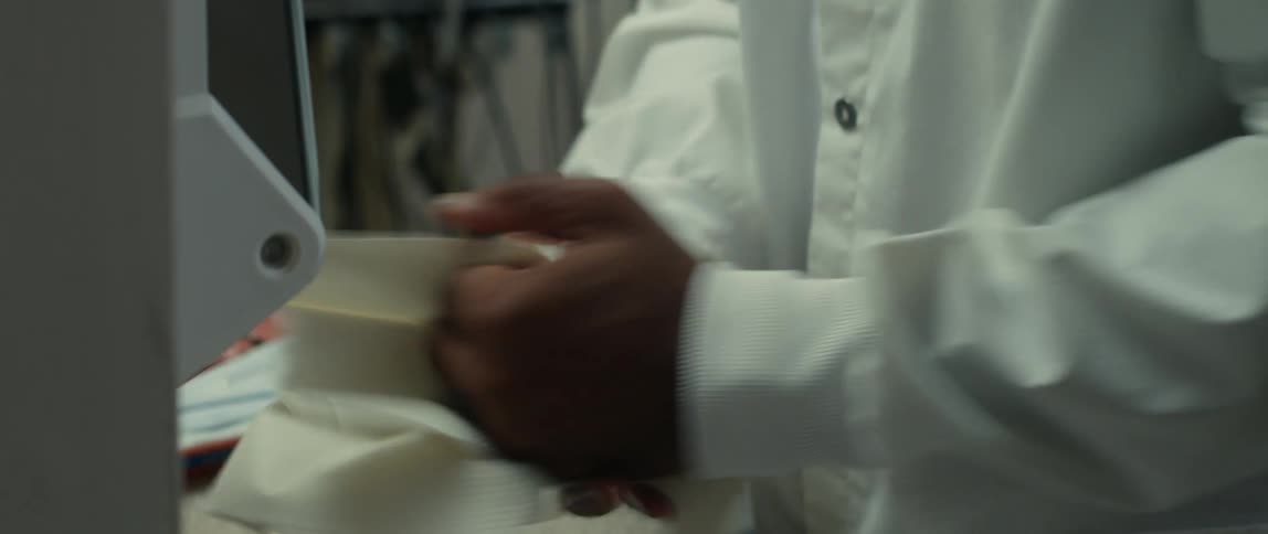 Close up of a doctor washing his hands before putting on latex gloves
