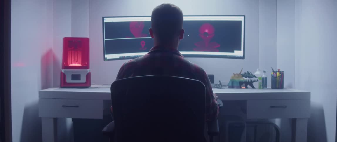 Man working on 3d design on a computer in a modern office