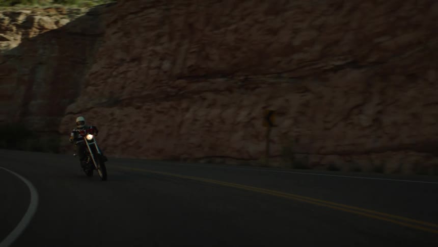 A person is riding a motorcycle on a highway