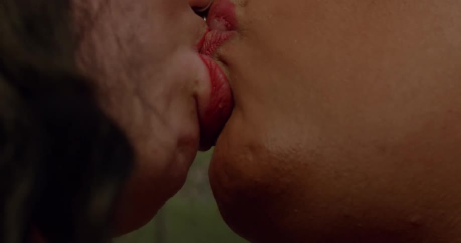 Two women kiss each other
