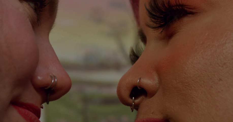 Two women are looking into each others eyes