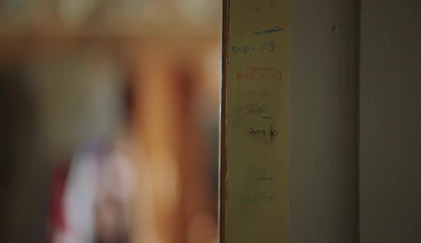 Handwritten markings on the door frame on the room of a house