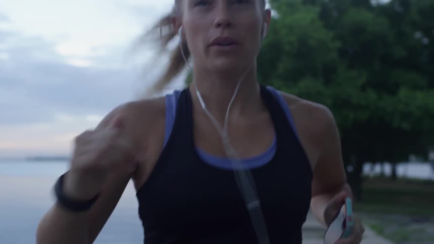 A blonde woman jogging