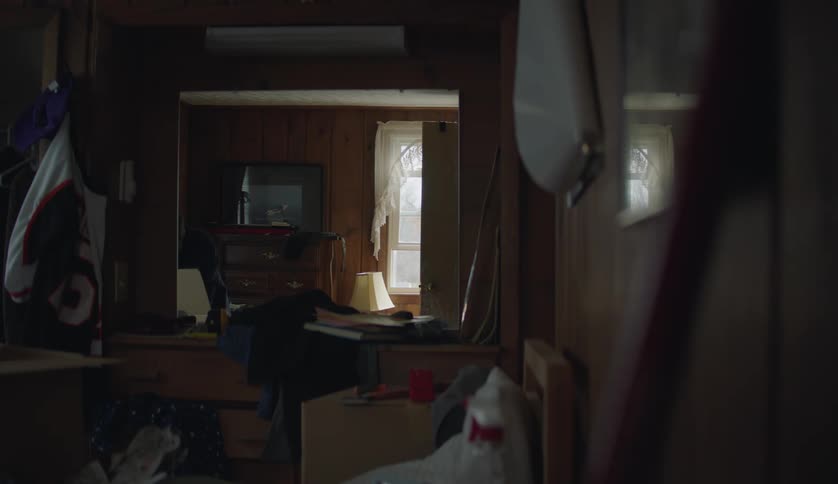 A man searches through items in the home