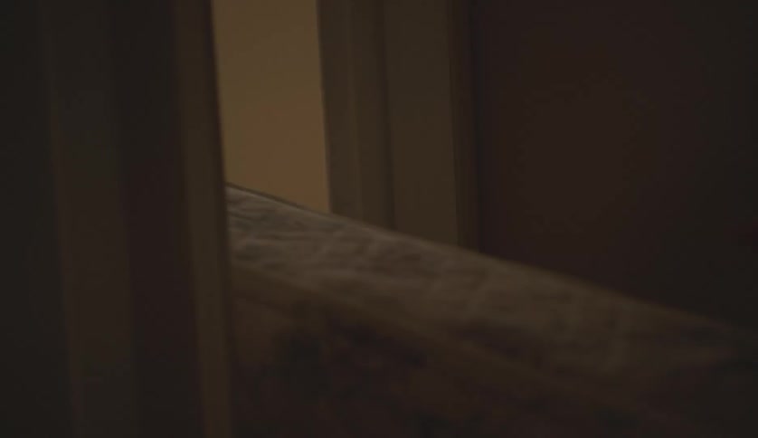 People moving a mattress from one room to another at home
