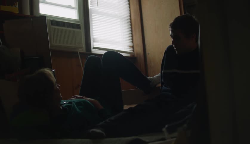 Two adults are hanging out with each other inside of there home