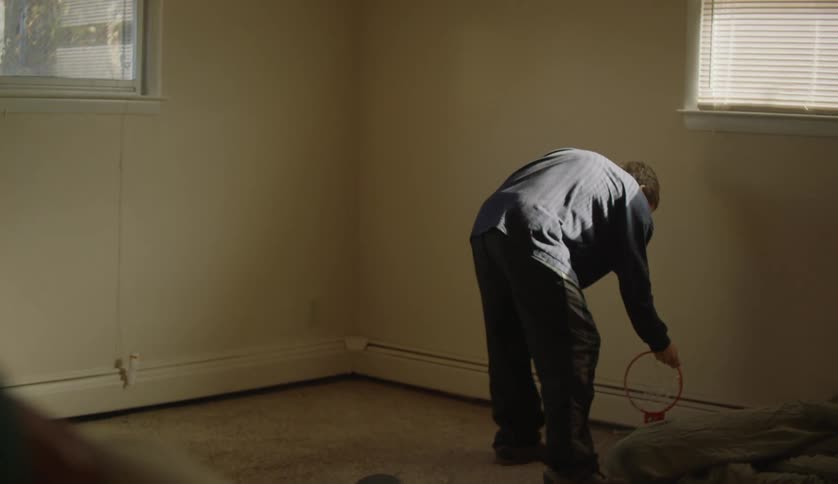 Young man moving in to a room on a new house