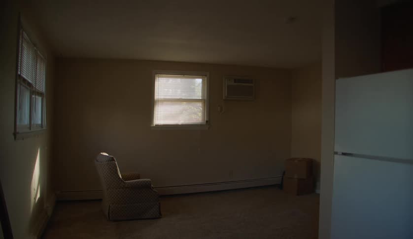 Chair under a window inside an empty room in a house