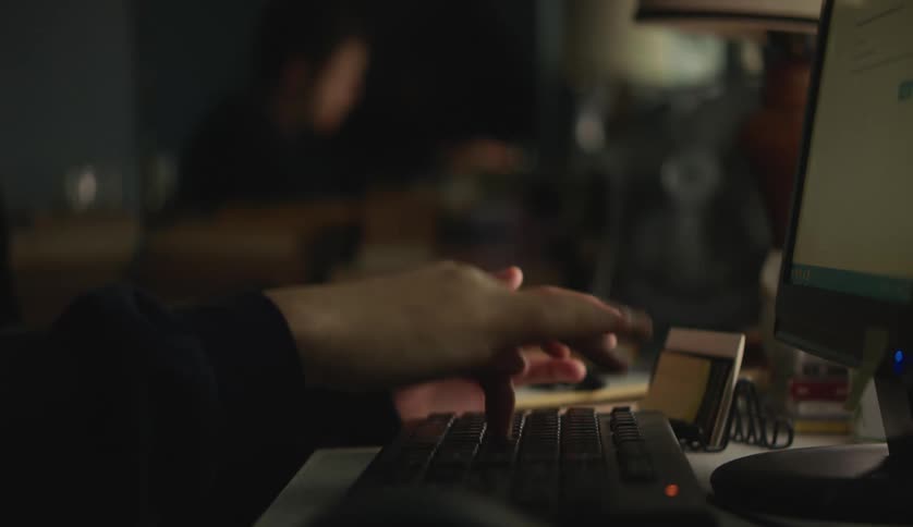 A person is typing on the keyboard