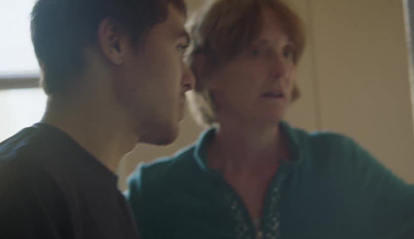 Grandmother checking the refrigerator with her grandson