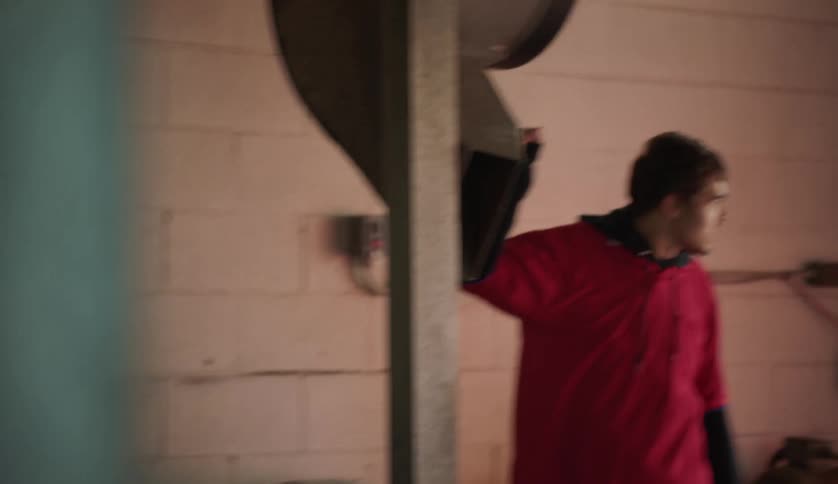 A male is standing inside of a building