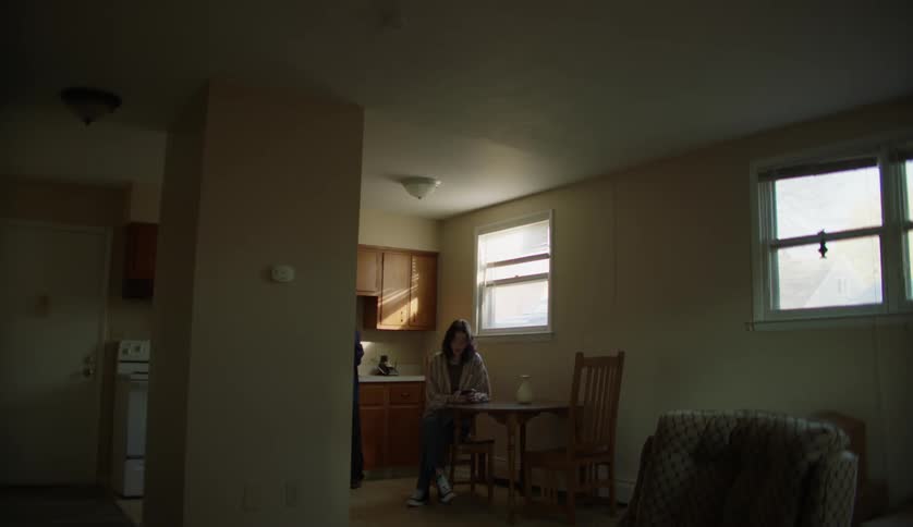 Boy and girl talking on the kitchen at home