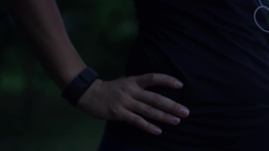 A woman standing with her hands on her hips