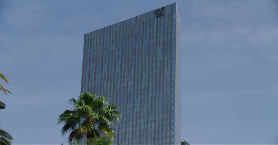 A hotel towers above downtown buildings
