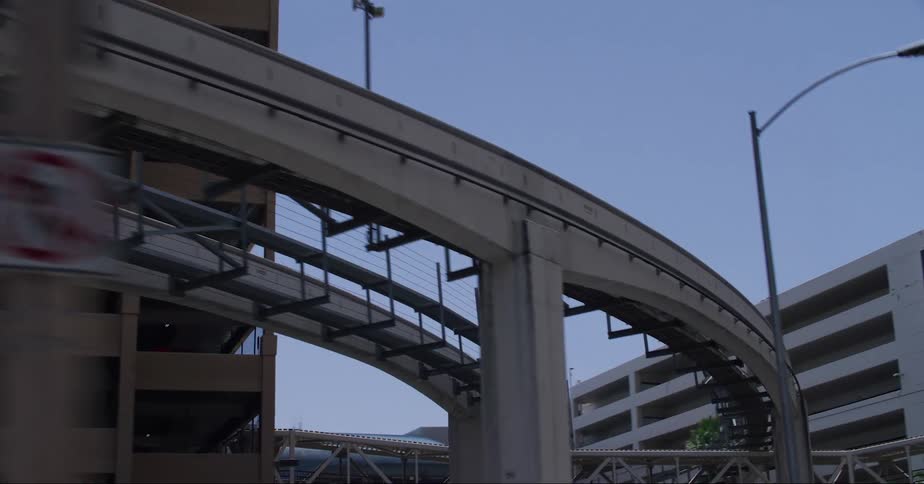 A cross sits atop a parking garage downtown