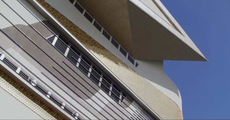 Abstract facade of a building in the city against a deep blue sky
