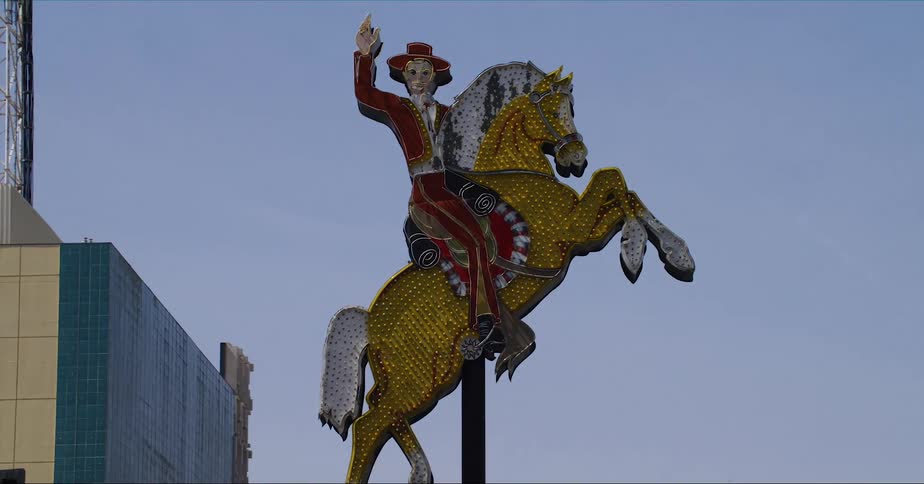 Art work depicting a skeleton on a horse welcomes people heading downtown